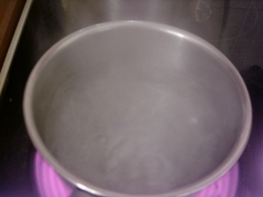 Keep an eye on the veggies in the wok & stir, and now ur pan should have the water boiling