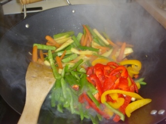 Now add the rest of three colors of peppers... and give a good stir, add a little water if the wok is too hot