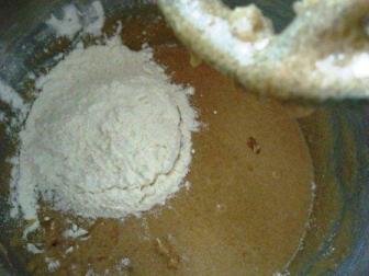Add 3 cups of flour gradually... and mix