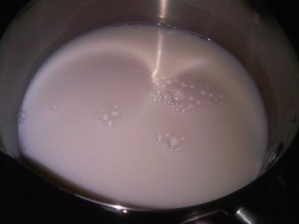 Add some milk into a pan and place on medium heat